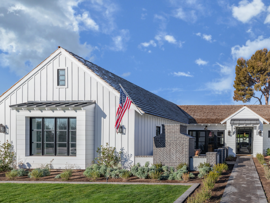 Home with vertical siding and American flag, vinyl siding options